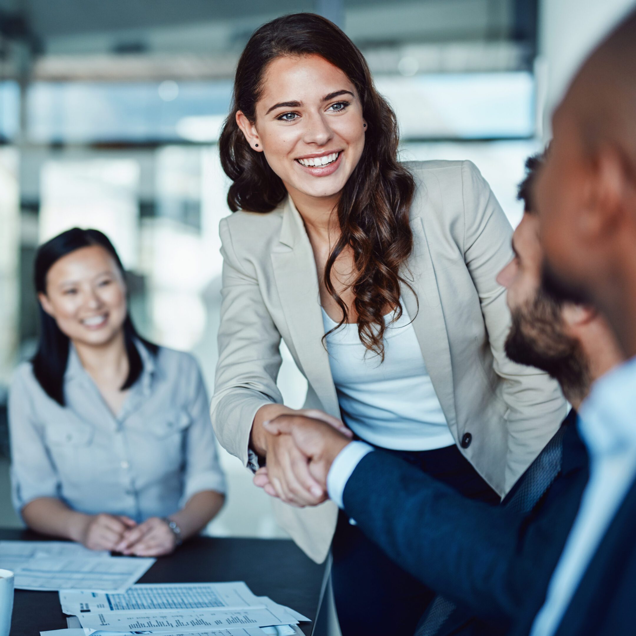 Professional handshake in office setting