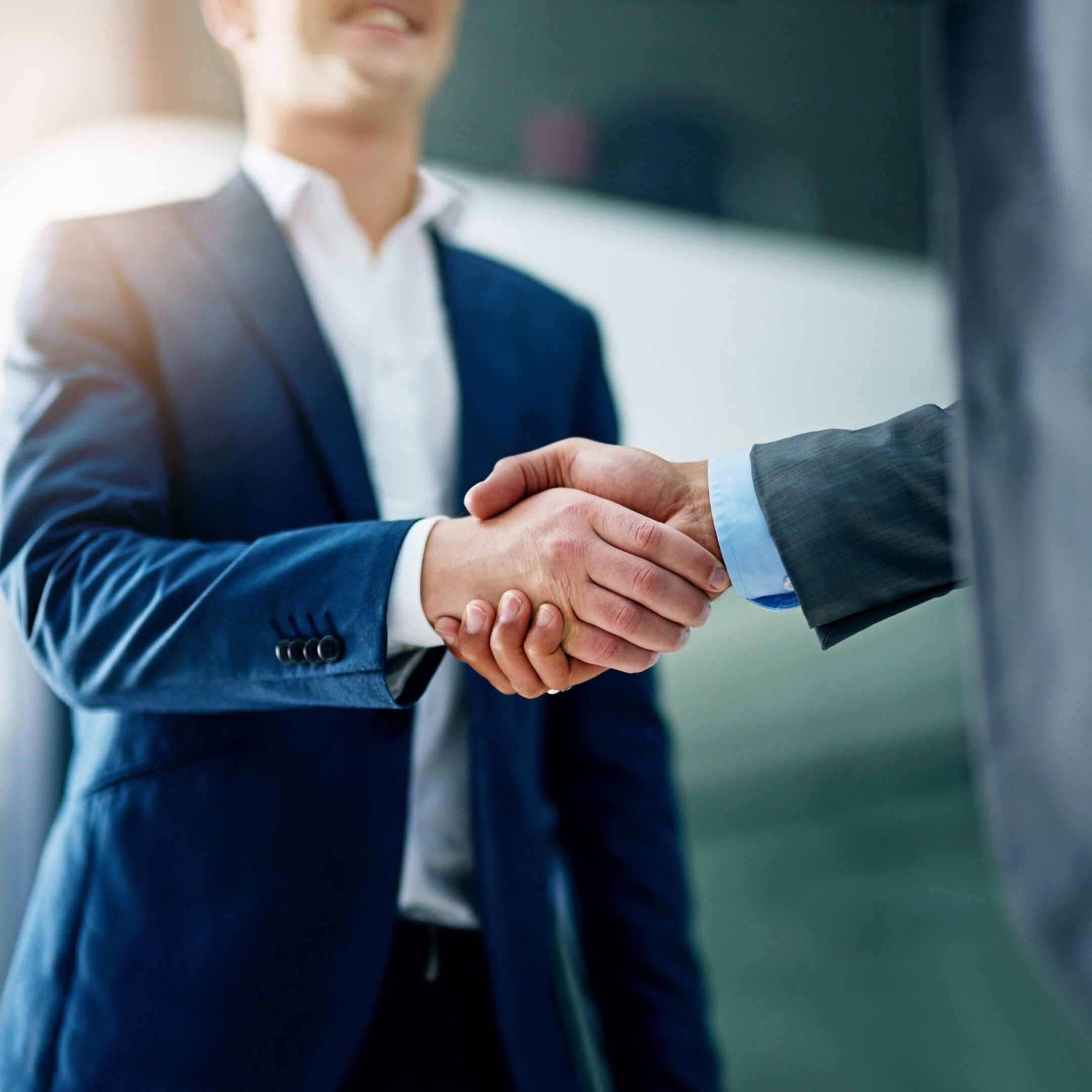 Professional handshake in office setting