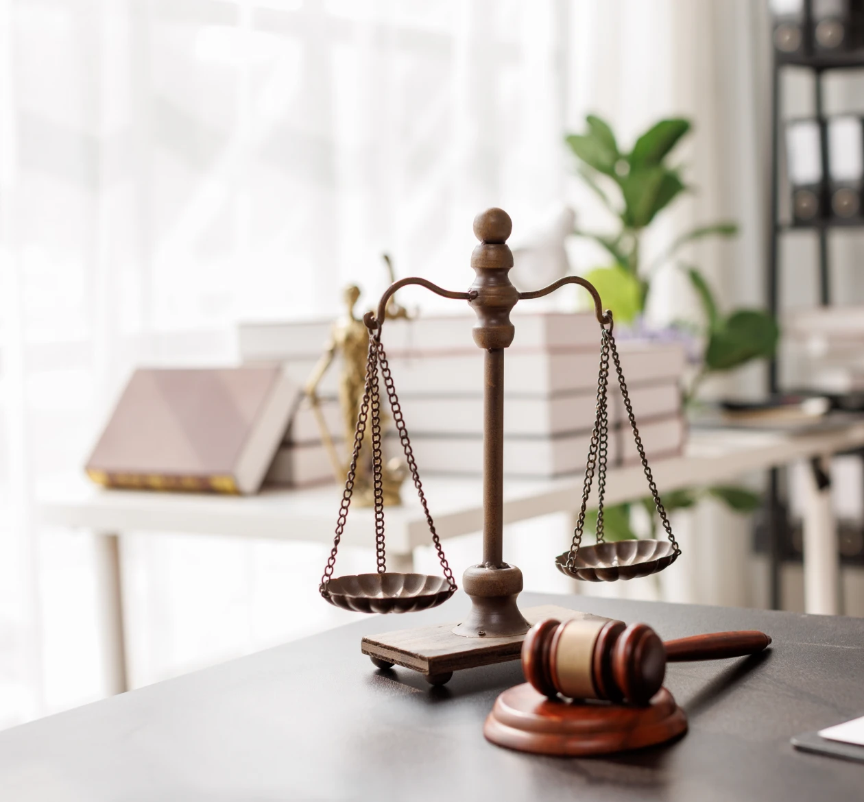 Scales of justice and gavel on desk