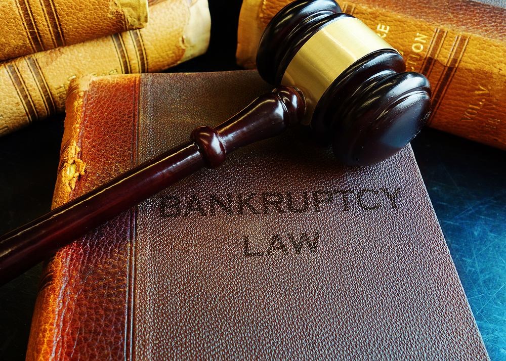 Gavel on bankruptcy law book